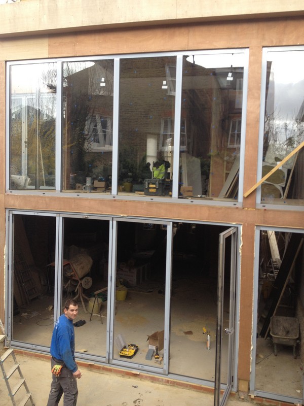 Aluminium bi-fold doors with two-storey glazing in Brent Cross
