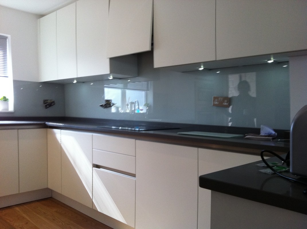Grey glass kitchen splashback with LED lighting in Brent Cross