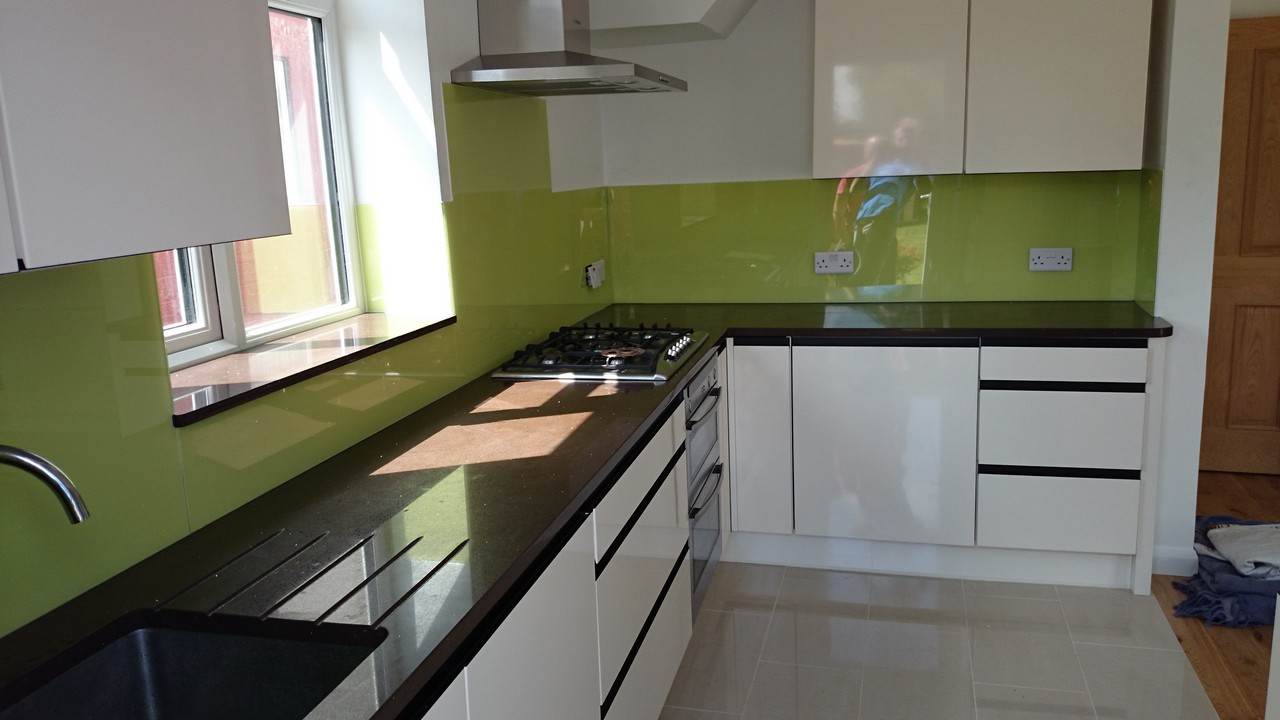 Lime green glass kitchen splashback installed by Brent Cross glaziers